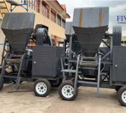 Concrete mixer with hoist
